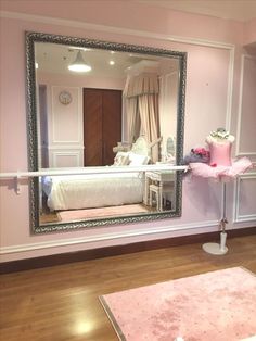 there is a large mirror on the wall in this room with pink carpet and furniture