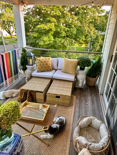 an outdoor living area with wicker furniture