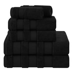 black towels stacked on top of each other