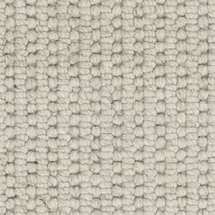 an up close shot of the texture of a carpet with white and gray colors on it