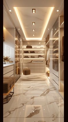 a walk in closet with marble flooring and lights on the ceiling is lit by recessed lighting