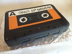 a cake made to look like an old school cassette tape