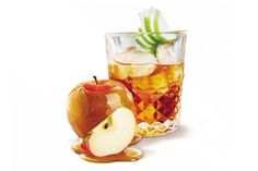 an apple and ice tea drink in a glass on a white background with the image of an apple cut in half