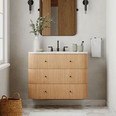 a bathroom with a wooden cabinet and mirror