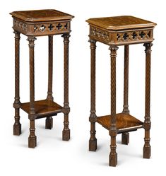 two wooden pedestals with carved designs on them