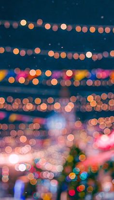 blurry image of city lights at night from the top of a building in an urban area