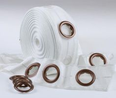 a roll of white cloth with brown rings on it and some other items around it