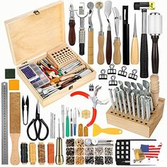 an assortment of kitchen utensils and tools in a wooden box on a white background