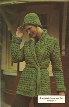 a woman wearing a green crocheted jacket and hat