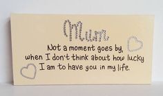 a card with the words mum written in cursive writing on it and hearts