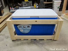 a cooler sitting on top of a wooden pallet