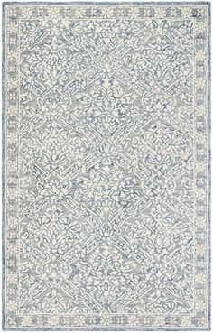 a blue and white rug with an intricate design