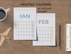 a desk with a calendar, pen and cup of coffee