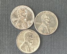 three silver dimes sitting next to each other