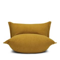 two yellow pillows sitting on top of each other