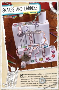 an advertisement for snakes and ladders on a table with tape, scissors, and other items