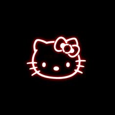 a hello kitty neon sign on the side of a building with a bow in it's hair