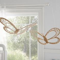 Our boho butterflies are crafted of handwoven rattan-so just like real butterflies, no two are exactly alike. Hang them on the wall to add graceful texture and dimension to their space. DETAILS THAT MATTER Mobile is made of wrought iron. Features 2 handmade butterflies pieces made of rattan. Finished in a hand painted oil-based, semi-gloss paint. Can be mounted on dry wall using a hook. KEY PRODUCT POINTS Pottery Barn Kids exclusive. Hardware is included (D-rings). Wipe clean. Imported. THIS SET Butterfly Baby Room Nurseries, Wildflower Butterfly Nursery, Tinkerbell Nursery Theme, Boho Butterfly Nursery, Butterfly Nursery Themes, Pottery Barn Nursery, Fall Butterfly, Fairy Mobile, Girly Nursery