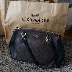 Like New. Brown And Black Coach Signature Purse. Been Carried Only Couple Of Times. Comes With Long Strap. Has 2 Zipper Compartments. Inside Compartment Has 2 Big Slots. Comes From Pet And Smoke Free. Little Dusty, Been In Storage Coach New York, Bags Coach, Coach Purse, Coach Purses, Coach Bags, Slots, Black And Brown, Satchel, Bag Lady