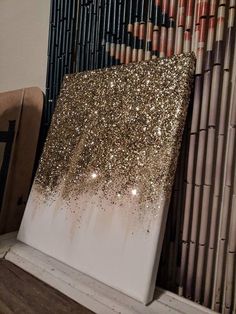 a painting with gold glitter on it