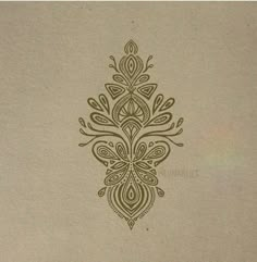 an intricately designed design on the back of a piece of paper with brown ink