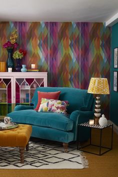 a living room with colorful walls and furniture