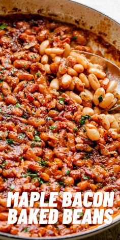 a pan filled with baked beans on top of a table