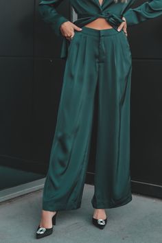 - Soft pleated wide-leg satin pants in emerald green- Side pockets- Concealed zip fly with hook-and-bar and button closure- Front pleats- Flat waistband- Designed in Sydney, Australia- Style Number: MG2303438 Model Katherine is 5'9 wearing a small SHOP THE LOOK Emerald Green Wardrobe, Green Satin Pants, Green Silk Pants, Australia Style, Green Side, Amazing Lace, Satin Pants, Native Style, Pants Large