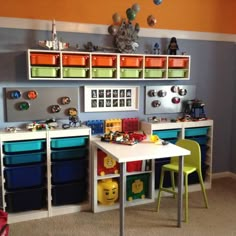 a child's playroom with toys and storage bins