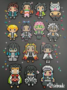 an assortment of pixelated characters are displayed on a black surface with beads and sprinkles