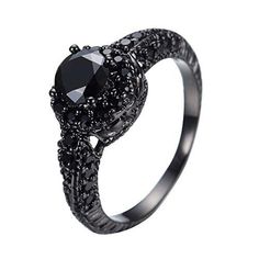 a black diamond ring with an intricate design on the front and sides, set in 18k white gold