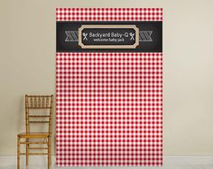 a red and white checkered table cloth with a wooden chair in front of it