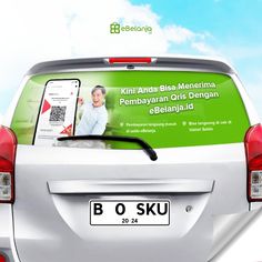 an advertisement on the back of a white car