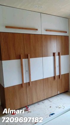 an unfinished kitchen with cabinets and cupboards in the process of being painted by someone