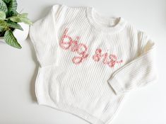 The perfect big sister gift! Sample shown is a sweater in cream with pink rose embroidery.  Big brother sweater here: https://www.etsy.com/listing/1710502447/big-brother-sweater-big-bro-sweater-baby?click_key=fcae6f62a8745508a07fa3f7205b9510004938d5%3A1710502447&click_sum=49b64b76&ref=shop_home_active_10&pro=1&frs=1 *If you're looking for a specific sweater or yarn color, please send me a message and I can source it for you. TO ORDER -Select size and sweater color via the drop down menus -In the personalization box, leave embroidery color SIZING AND FIT -All sweaters are an OVERSIZED fit, perfect for watching baby grow throughout their first year, layering, or having a long lasting, heirloom piece. If you'd like a more snug fit, order a size down. WASHING INSTRUCTIONS: Turn sweaters inside Big Sis Sweater, Leave Embroidery, Baby Announcement Big Sister, Baby Jumpers, Sister Announcement, Big Sister Announcement, Big Sister Gifts, Pull Bebe, Sister Shirt