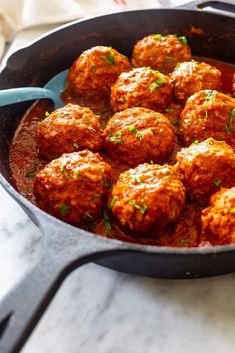 some meatballs are in a pan on the stove