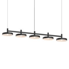 four lights are hanging from the ceiling in this modern style kitchen island light with black metal finish