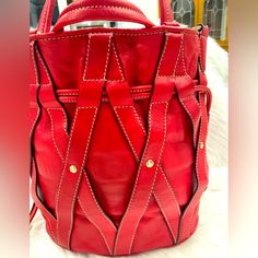 Beautifully Constructed Lancel Paris Bucket Bag. Red Leather With A Leather Cross Over. Gold Hardware In Great Condition. There Is Some Rubbing To The Bottom Piping. See Photos-From Normal Use. Dust Bag Included. Appropriate Measurements: Height 12” Length 10.75” Depth 7” Large Bucket Bag. 1 Zipper Pocket And 2 Side Pockets Located On Inside. Clean Inside. Hand Strap Drop 6” Shoulder Strap Drop 18” Bucket Bags For Women, Bag Trend 2024 2025, Red Leather Bucket Bag With Double Handle, Luxury Red Leather Bucket Bag, Chic Red Bucket Bag With Gold-tone Hardware, Red Leather Bucket Bag For On-the-go, Red Bucket Bag With Gold-tone Hardware For Shopping, Leather Bucket Bag, Bag Trends