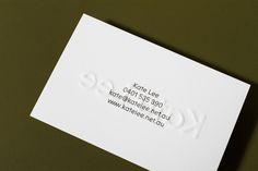 a close up of a business card with the word kote lee on it's back