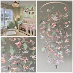 a baby's crib with pink and green butterflies hanging from the ceiling next to a bed