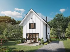 a white house with black shutters on the front and side windows is surrounded by greenery