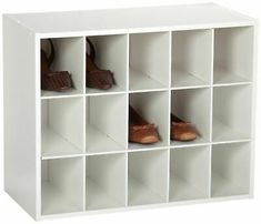 the shoe rack is white and has several pairs of shoes on it's shelves