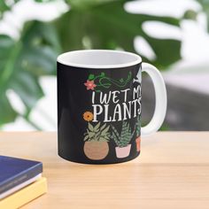 a coffee mug that says i wet my plants on the front and back of it