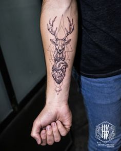 a man with a deer tattoo on his arm