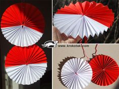 red and white paper fans hanging from strings