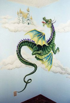 there is a dragon painted on the wall in this child's room with clouds and castle