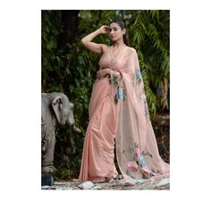 Product Description:- Pink & Peach floral Handmade Sari women Designer Saree For Wedding Flower Pattern Sari Plain Sleeveless Deep Backless Blouse Party Wear Sari Grace this beautiful outfit from anuthhi exclusive gajal collection. zardozi cutdana sequence,pearl, semi pricious stone work by our skilled artisian of anuthhi Item Contain - Saree Material : Organza Size : All Size Available( M,L,XL, XXL) Sleeves : Sleeve Color : Pink ( Show In Image ) Work : Printed Work ( As Shown In Image ) Model Sleeveless Saree With Sheer Dupatta For Wedding, Sleeveless Pre-draped Saree For Wedding, Fitted Sleeveless Organza Pre-draped Saree, Elegant Summer Silk Pre-draped Saree, Pink Traditional Drape Blouse For Summer, Summer Georgette Pre-draped Saree For Reception, Summer Pre-draped Georgette Saree With Sheer Dupatta, Pink Pre-draped Saree For Summer, Elegant Sheer Saree For Wedding