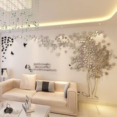 the living room is decorated in white and silver