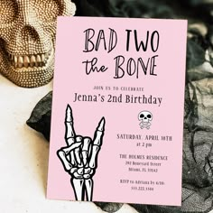 a pink birthday party card with a hand holding a rock and roll sign on it