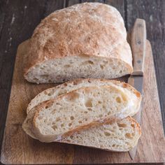 two loaves of bread on a cutting board